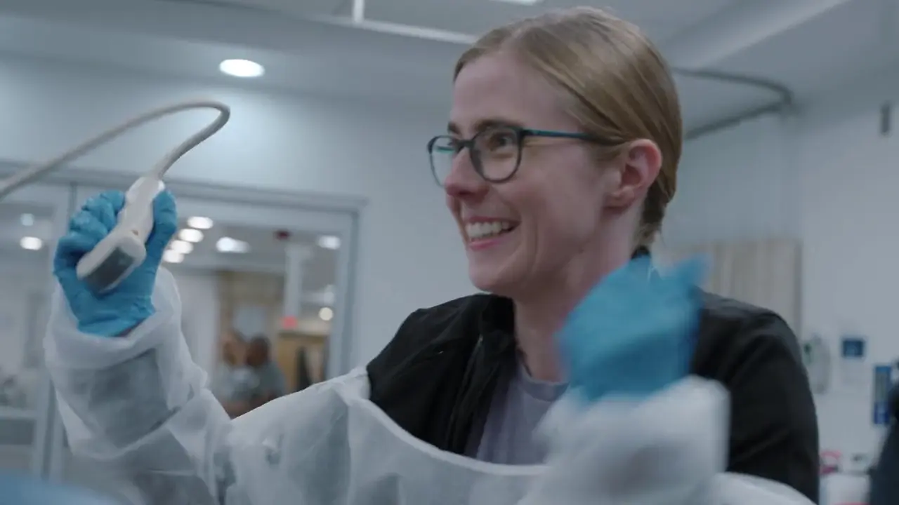 Resident performing E-FAST exam.